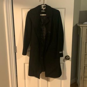 Very warm and kept in a coat bag. Small hole on rgt shoulder easy for seamstress